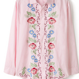 Pregnant woman wearing pink lounge shirt
