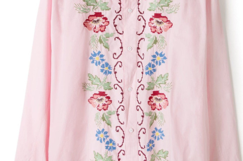 Pregnant woman wearing pink lounge shirt