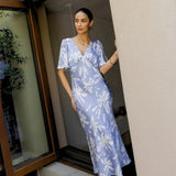 Model wearing Rewritten Ellis Dress in Blue Lily Print