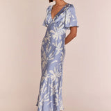Model wearing Rewritten Ellis Dress in Blue Lily Print