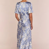 Model wearing Rewritten Ellis Dress in Blue Lily Print