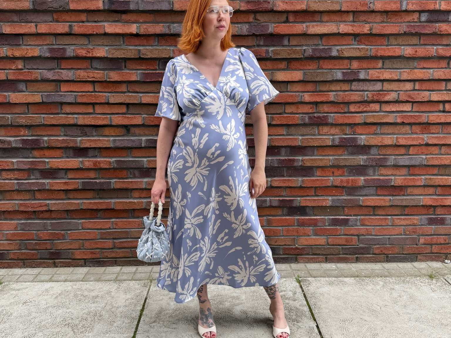 Pregnant Model wearing Rewritten Ellis Dress in Blue Lily Print