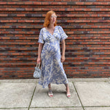 Pregnant Model wearing Rewritten Ellis Dress in Blue Lily Print