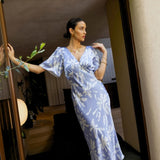 Model wearing Rewritten Ellis Dress in Blue Lily Print