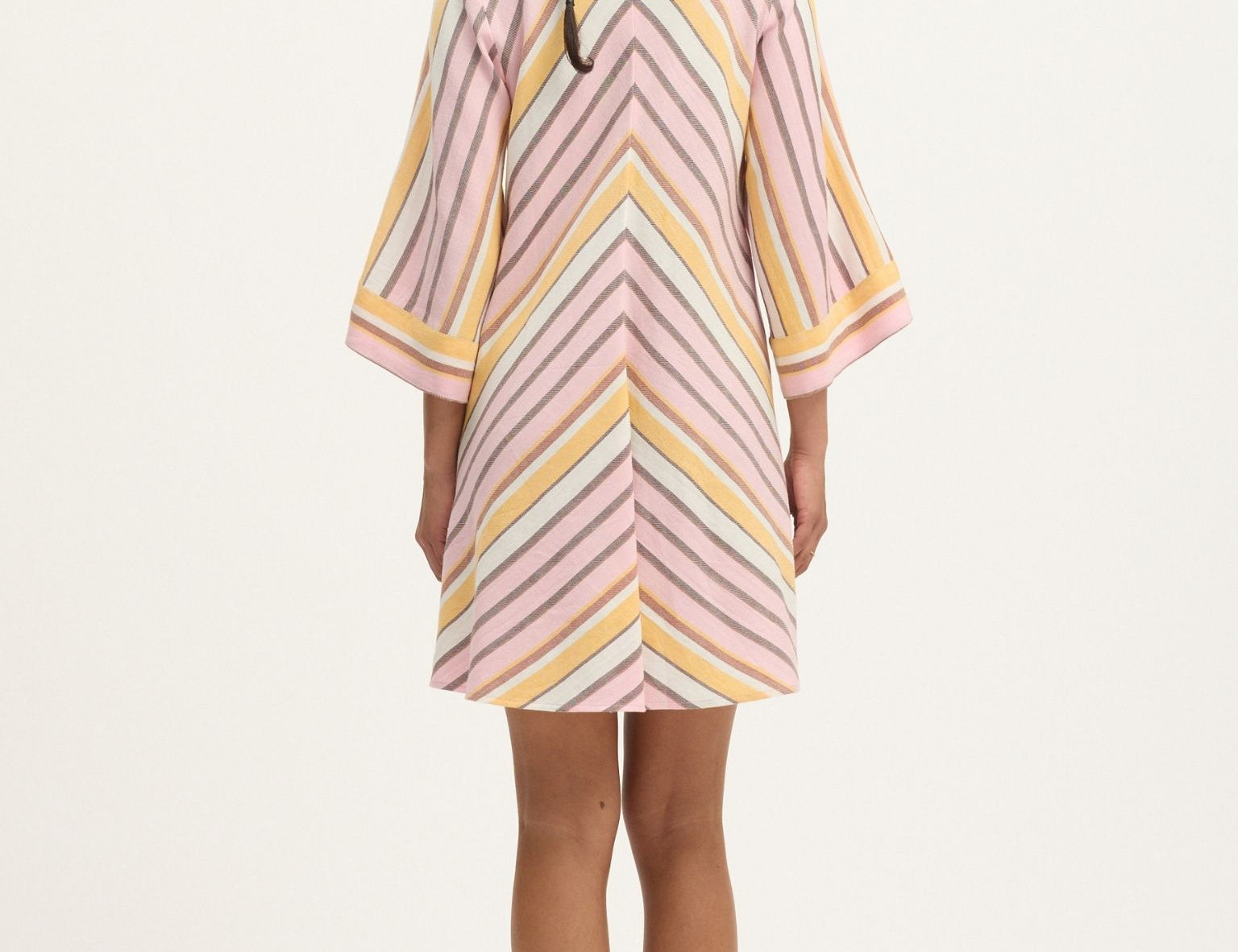 Back view of Summery Copenhagen Martha Mini Dress in Pink Mist with fluted sleeves and V neckline