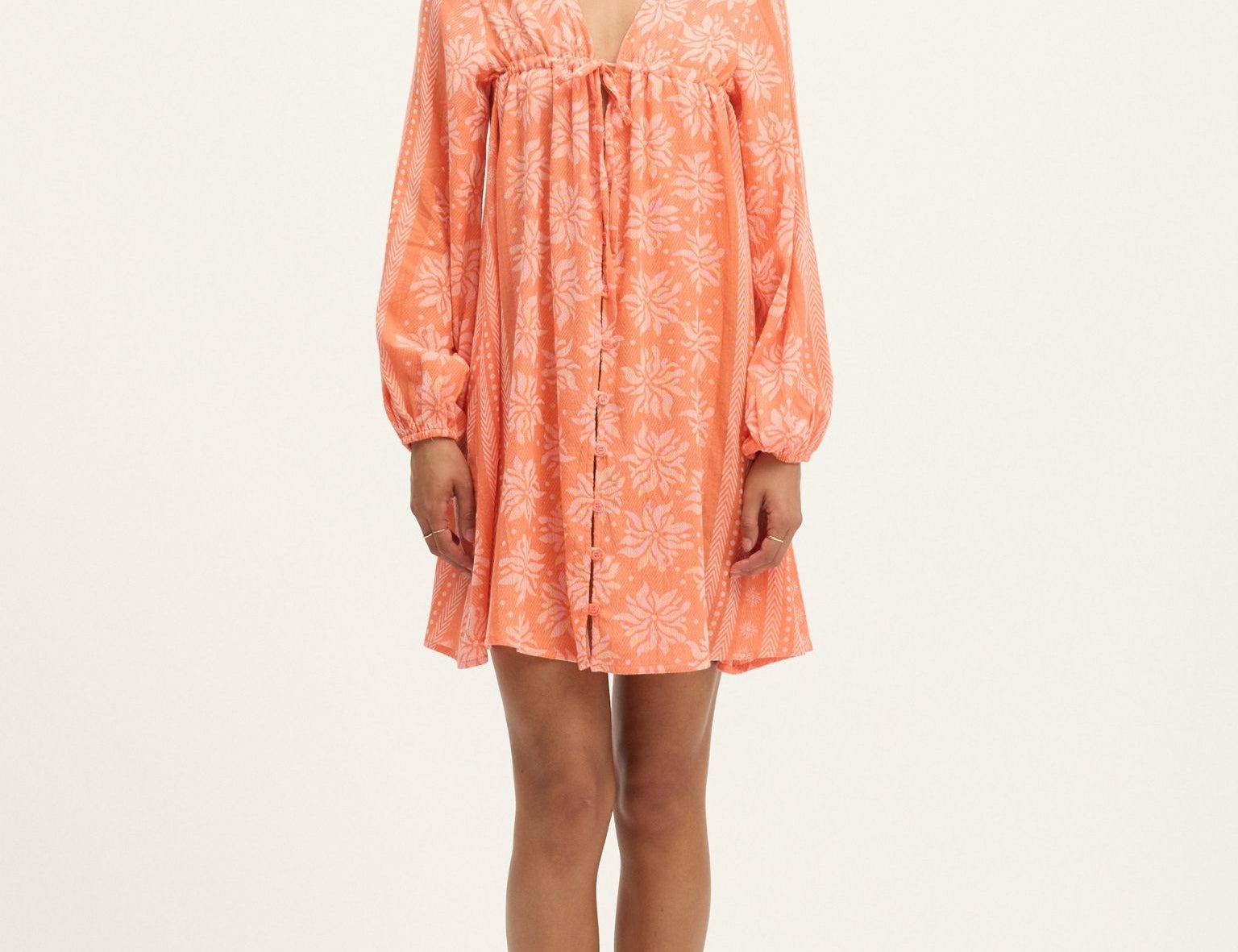 The Deborah Waffle Mini Dress in Camelia by Summery Copenhagen delivers vibrant energy and bump-friendly comfort in one swingy, breathable package.