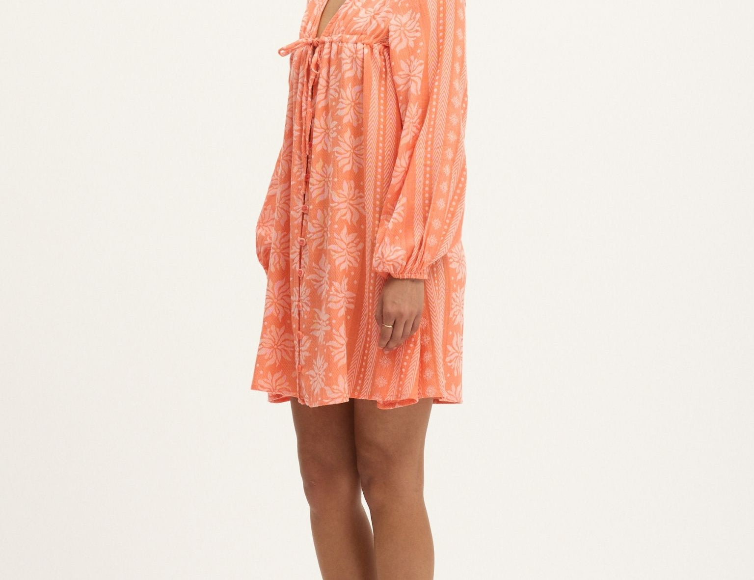 The Deborah Waffle Mini Dress in Camelia by Summery Copenhagen delivers vibrant energy and bump-friendly comfort in one swingy, breathable package.
