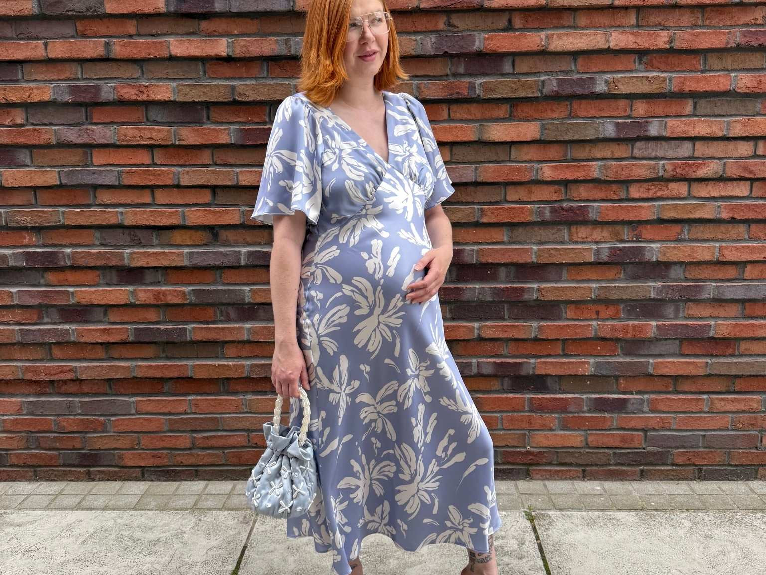 Pregnant Model wearing Rewritten Ellis Dress in Blue Lily Print