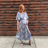 Pregnant Model wearing Rewritten Ellis Dress in Blue Lily Print