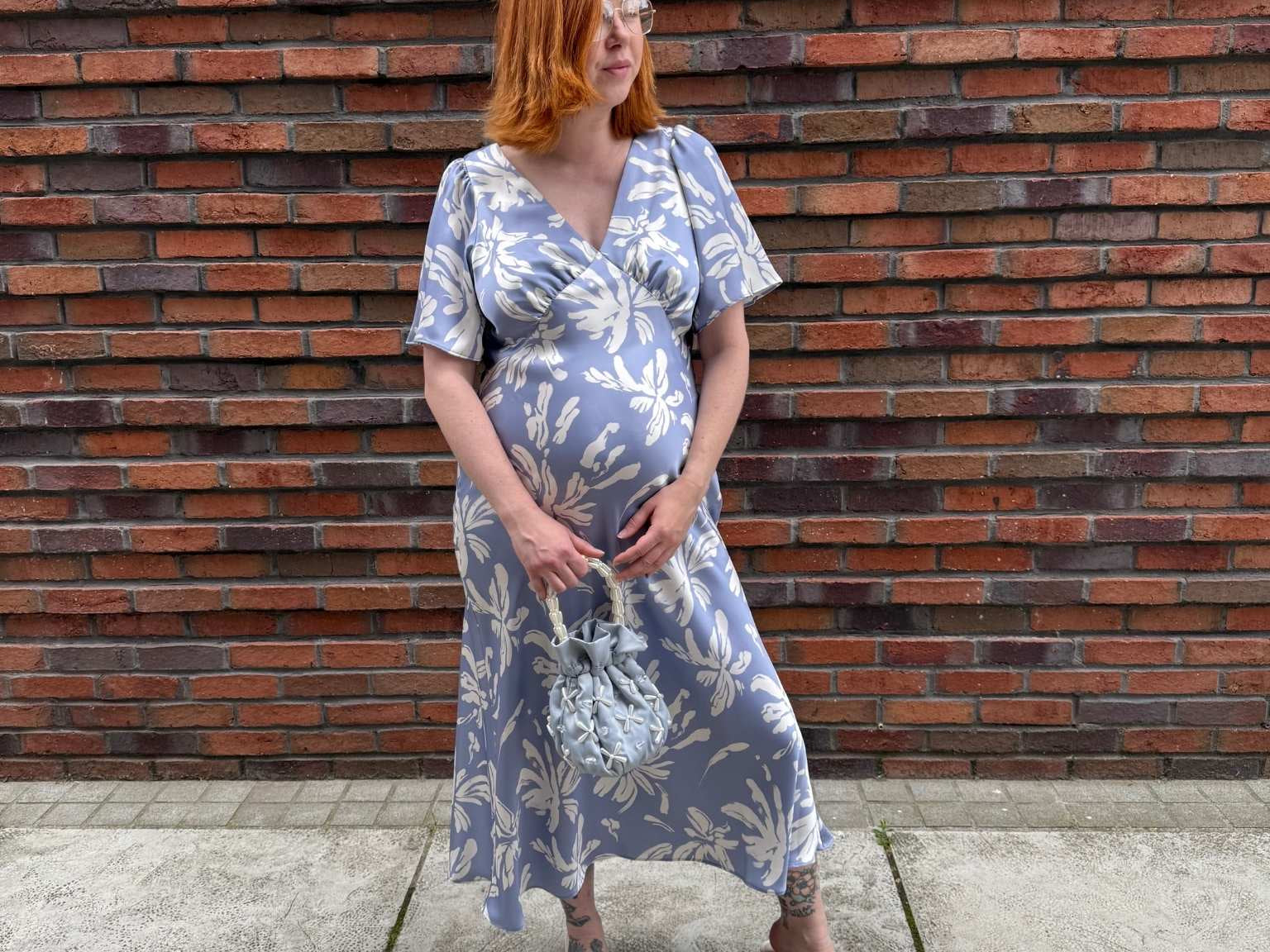 Pregnant Model wearing Rewritten Ellis Dress in Blue Lily Print