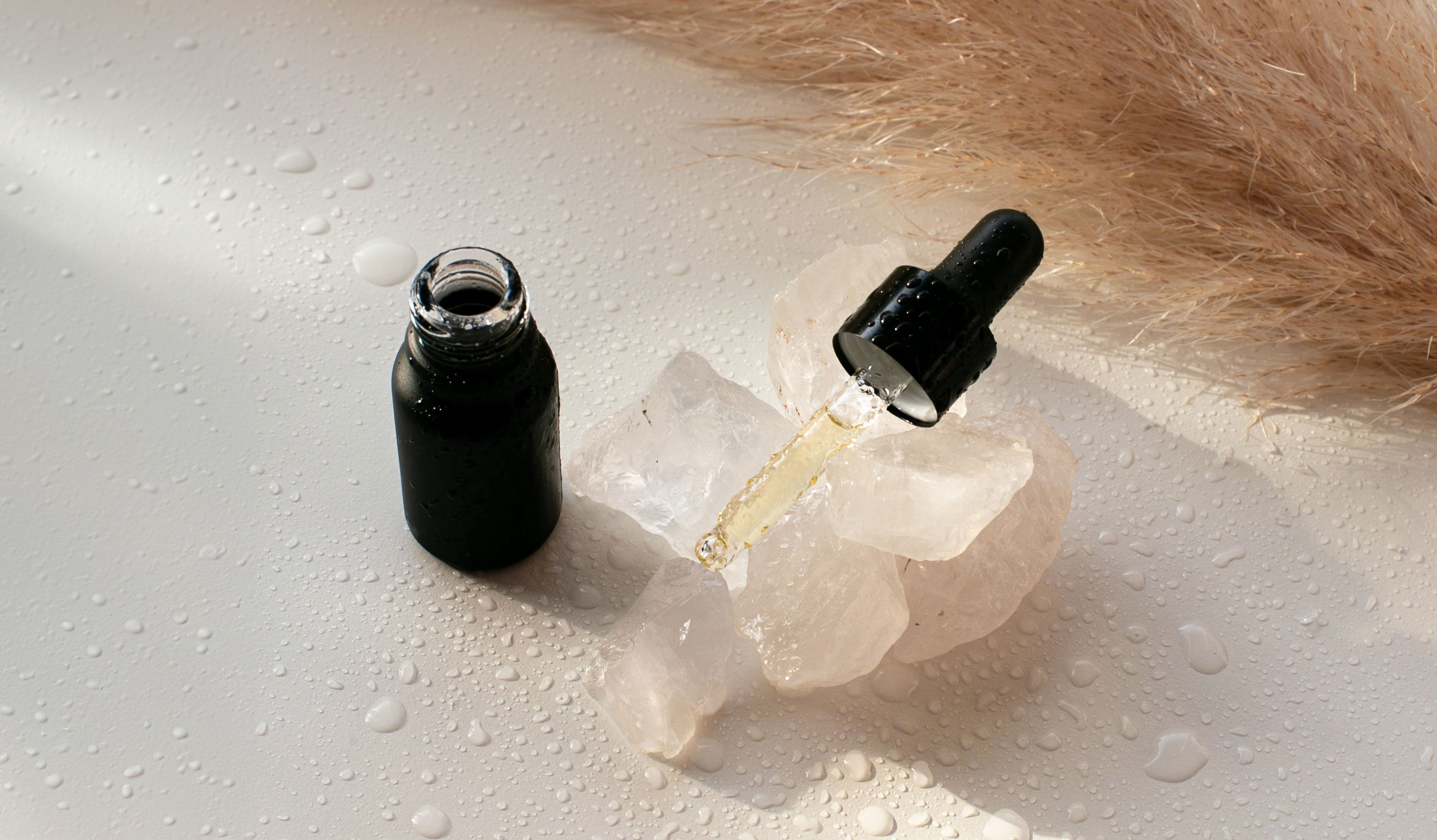 Aromatherapy essential oils in a pipette on a quartz crystal