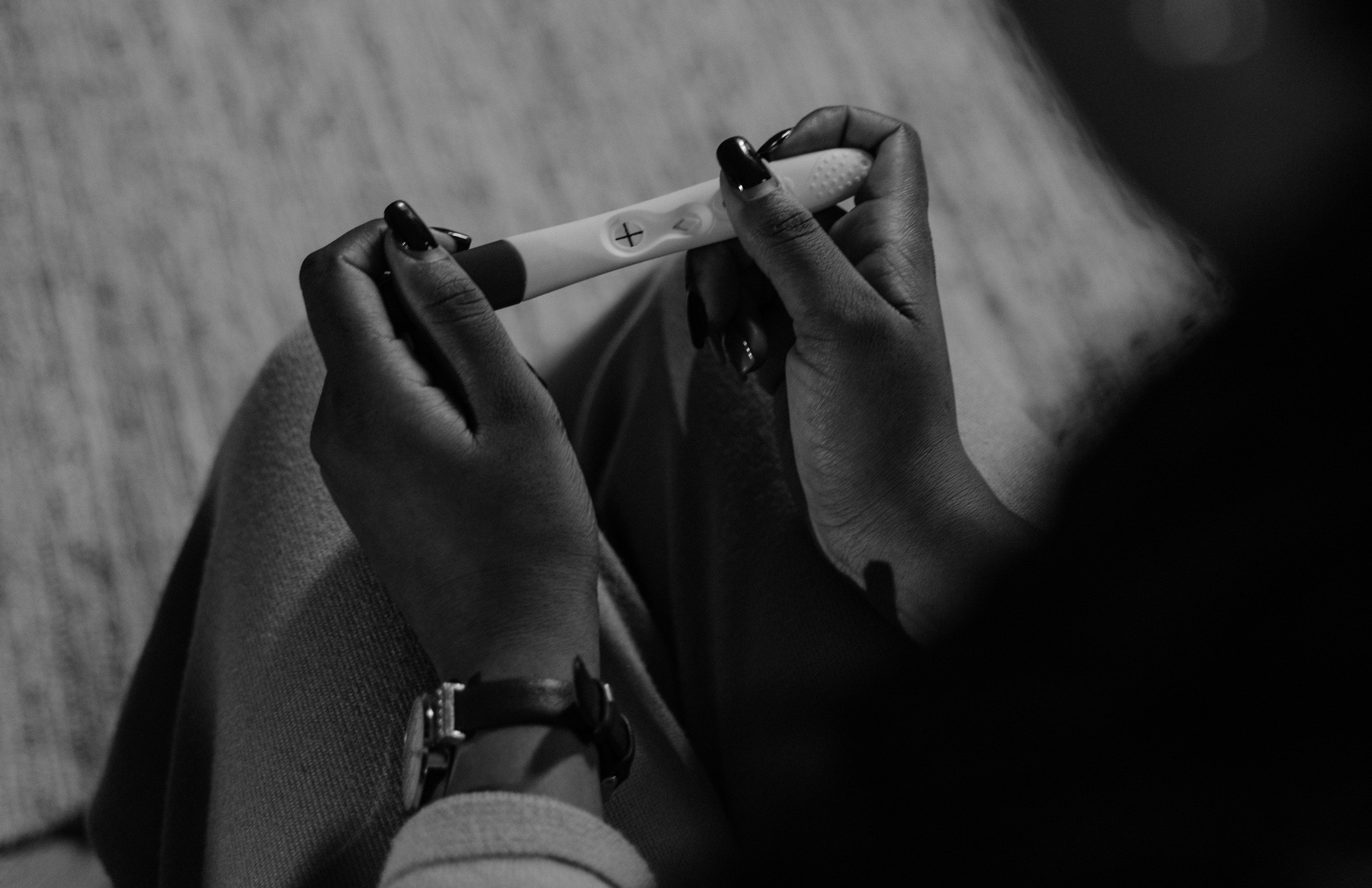 Woman taking pregnancy test