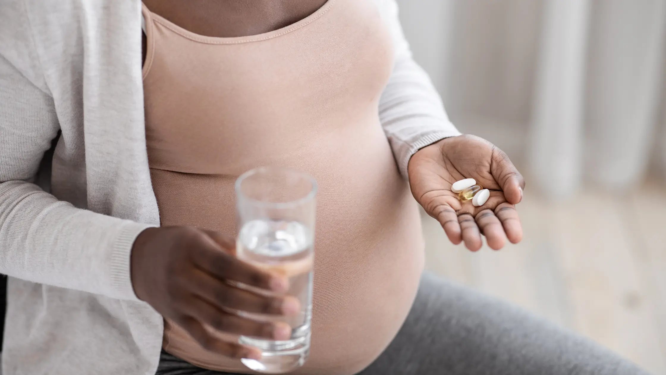 Pregnant woman taking vitamins 