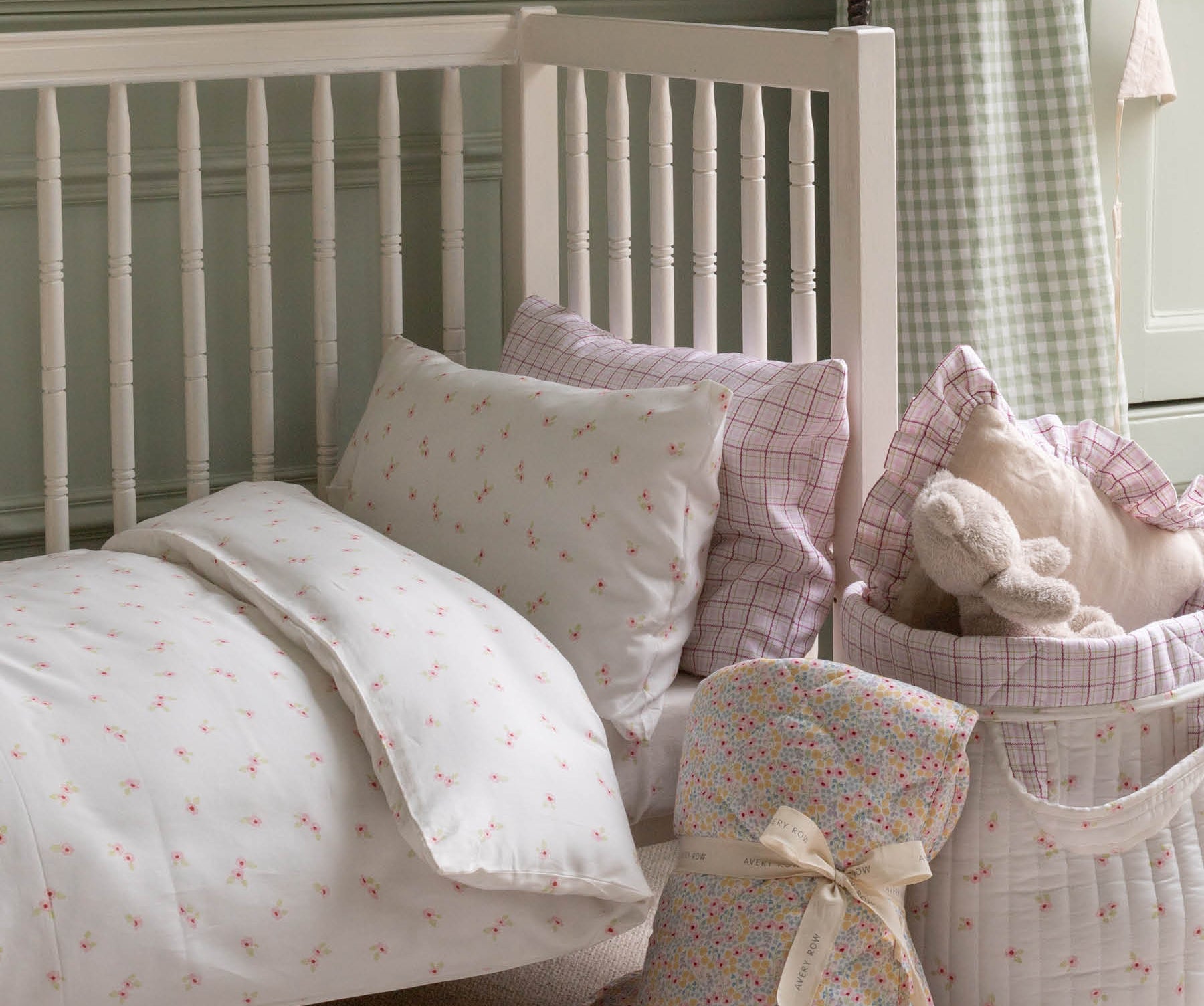 nursery bed with cosy quilt and pillows