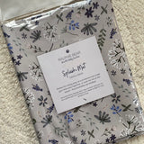 Ralphie Bear floral splash mat packaging on a carpeted floor