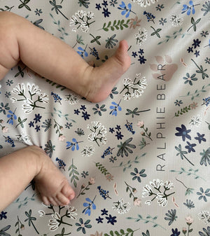 Floral patterned paper with 'Ralphie Bear' branding on a white background
