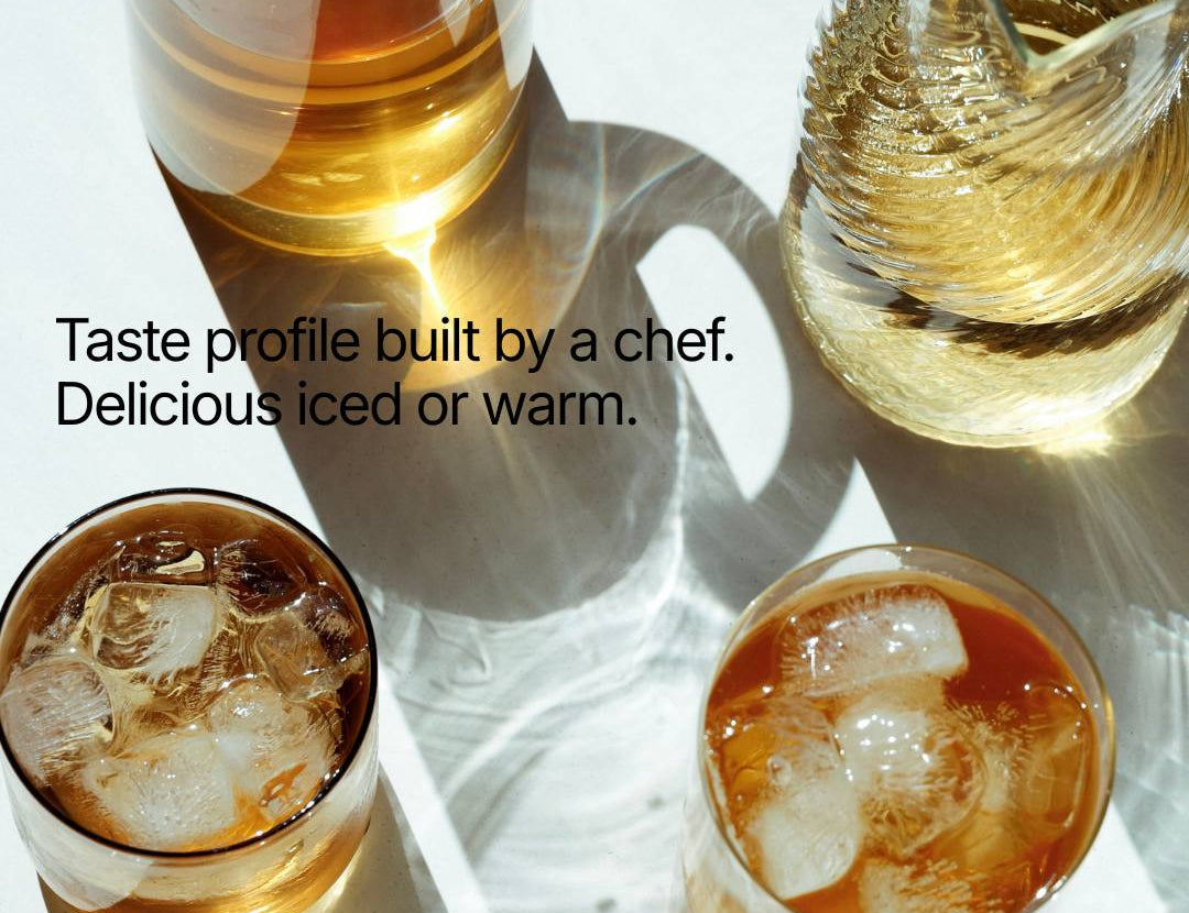 Four glasses of iced and warm beverages on a white surface with text about a chef's taste profile.