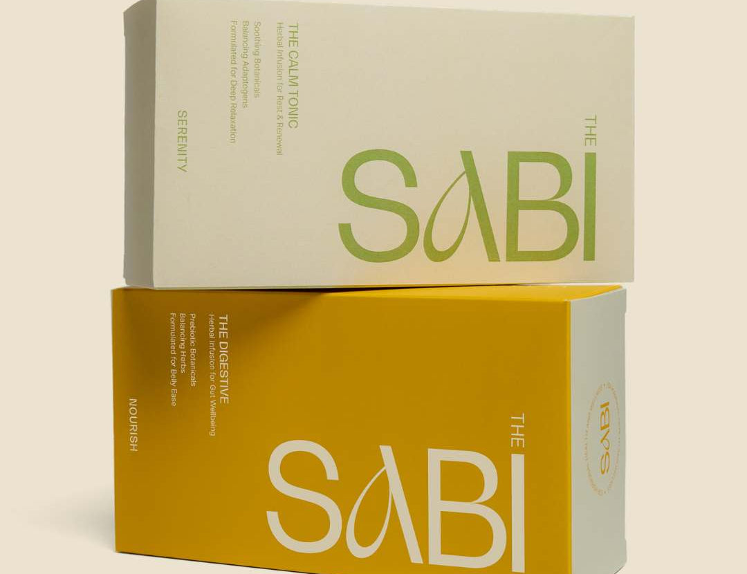 Two 'The Sabi' boxes, one beige and one yellow, on a beige background.