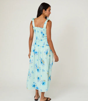 back of Blue floral midi dress on female model 
