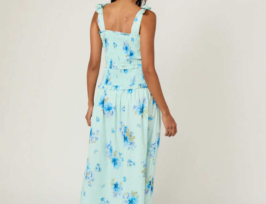 back of Blue floral midi dress on female model 
