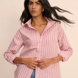 Woman wearing pink stripe shirt