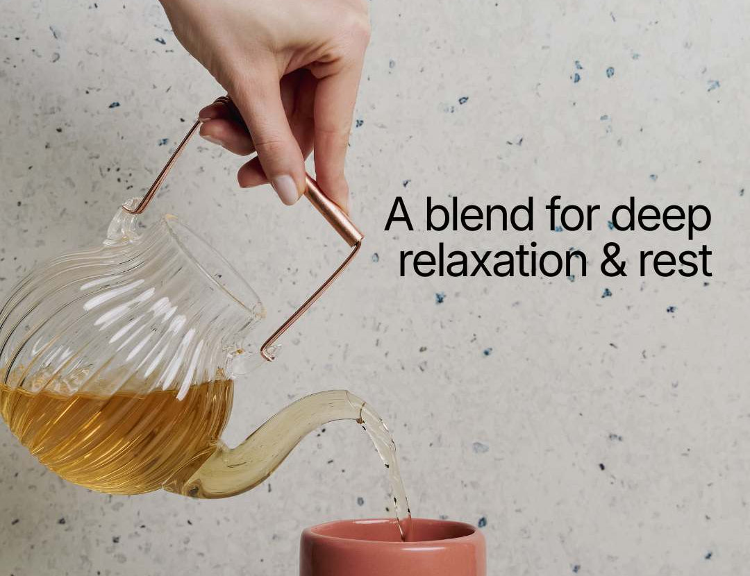 Tea being poured from a glass teapot into a pink cup with text 'A blend for deep relaxation & rest' on a speckled surface.