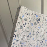 Floral patterned paper with 'Ralphie Bear' branding on a white background