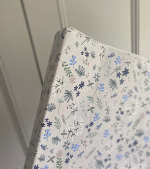 Floral patterned paper with 'Ralphie Bear' branding on a white background