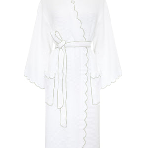 A white textured bathrobe with scalloped edges and a matching tie belt, shown against a plain white background.