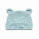 Light blue baby hat with bear ears and 'El Jefe' embroidery on a white background