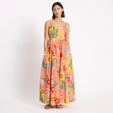 Woman wearing a colorful floral dress on a white background