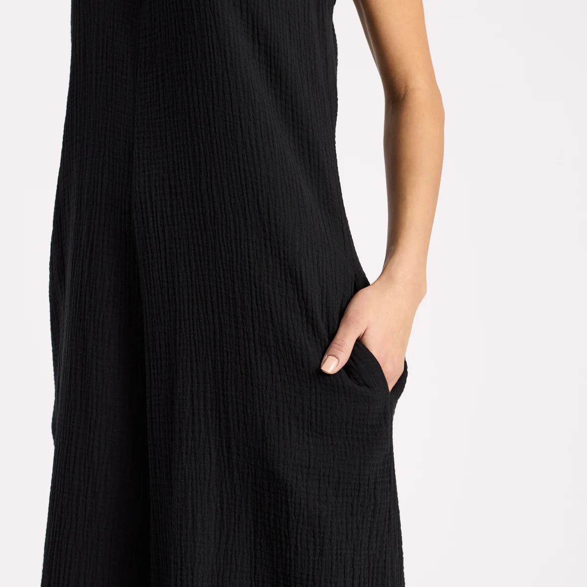 Black jumpsuit with pockets with a plain background