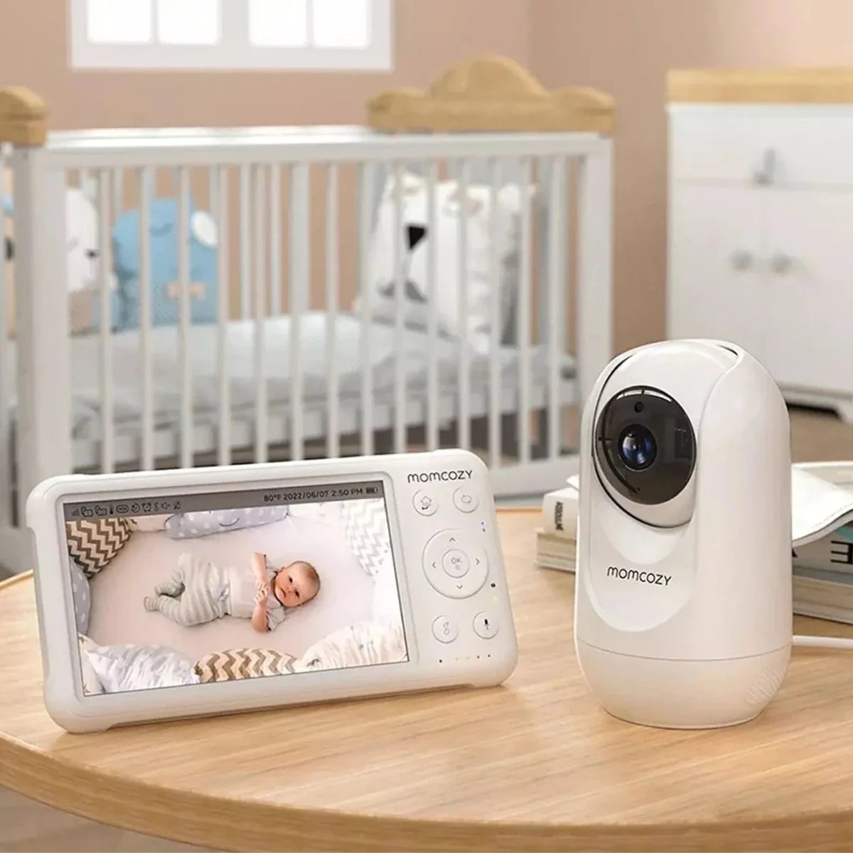 Baby monitor system with display and camera in a nursery setting