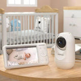 Baby monitor system with display and camera in a nursery setting