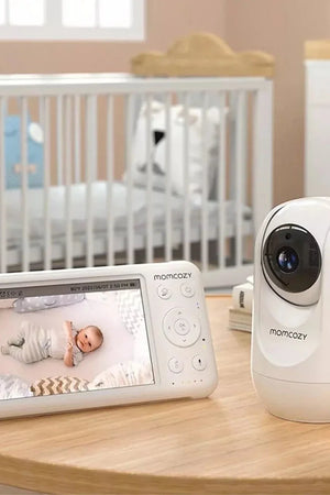 Baby monitor system with display and camera in a nursery setting