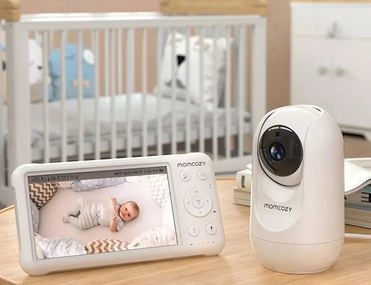 Baby monitor system with display and camera in a nursery setting