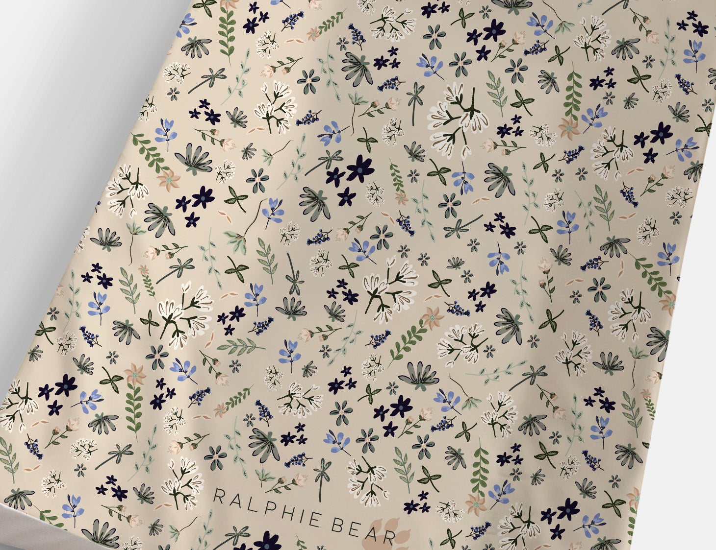 Floral patterned paper with 'Ralphie Bear' branding on a white background