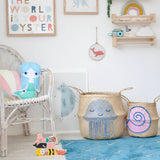 Shell belly basket, large, beside a jellyfish basket in a child's room with a mermaid cushion and toy sea animals