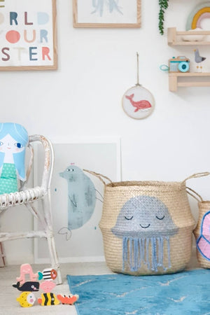 Shell belly basket, large, beside a jellyfish basket in a child's room with a mermaid cushion and toy sea animals