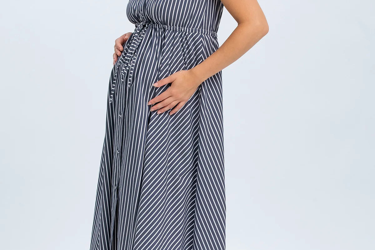 Woman wearing a striped dress on a white background
