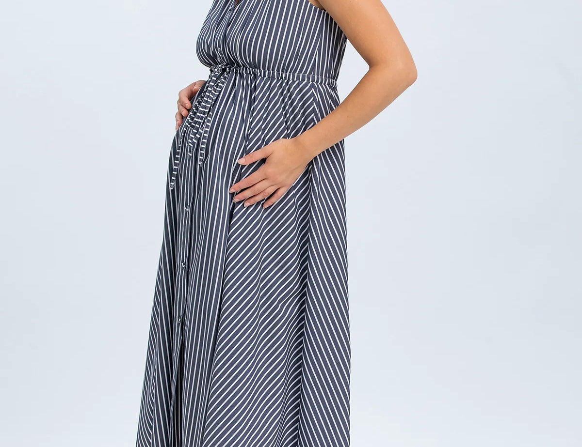 Woman wearing a striped dress on a white background