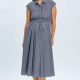 Woman wearing a blue and white striped dress on a white background