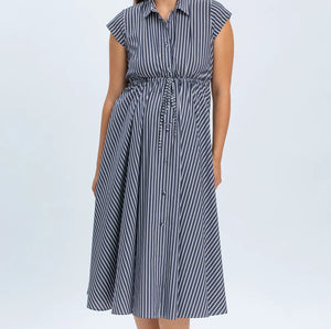 Woman wearing a blue and white striped dress on a white background