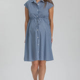 Woman wearing blue stripe shirt dress on grey background