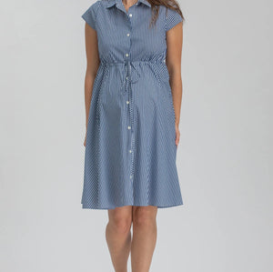 Woman wearing blue stripe shirt dress on grey background