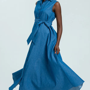 Woman wearing a blue sleeveless dress with buttons on a white background