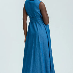 Woman wearing a blue dress on a white background