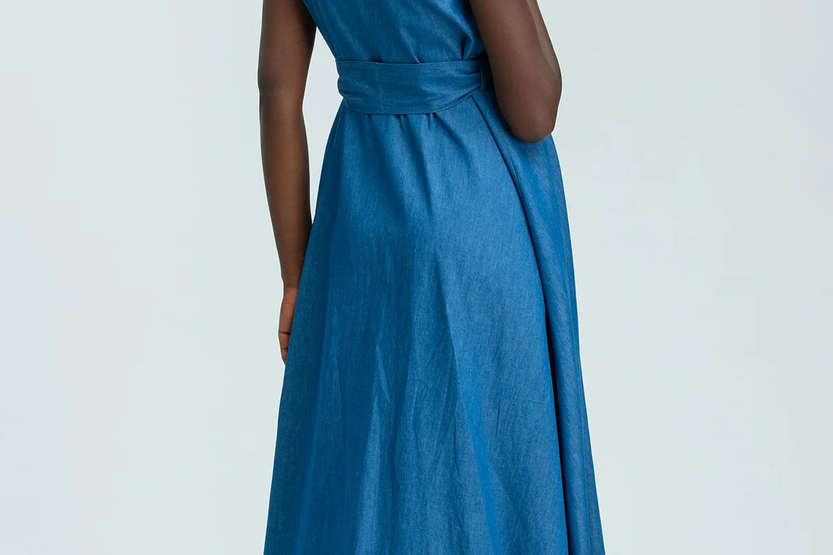 Woman wearing a blue dress on a white background
