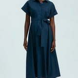 Woman wearing a blue dress on a white background