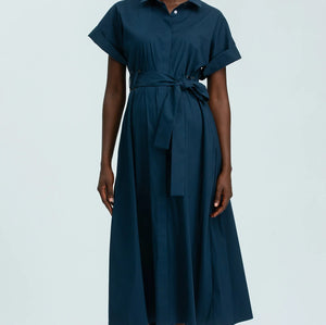 Woman wearing a blue dress on a white background